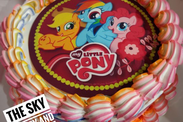 C011 - small round colourful cake with little pony picture